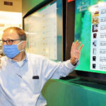 President and CEO, Jeffrey Barton, with Digital Menu at Bountiful Farms Natick Dispensary - Credit Art Illman (Wicked Local / Metro West Daily News)
