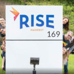 Sign and Team Members at Rise Amherst Dispensary - Credit: Rise